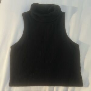 Black sleeveless turtle neck